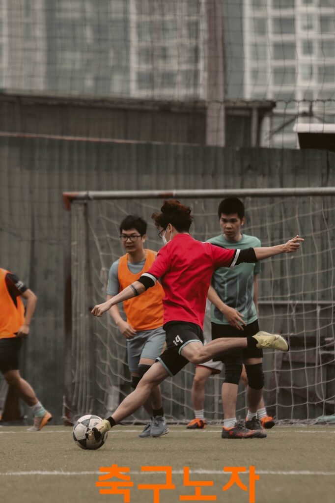 a group of people playing football